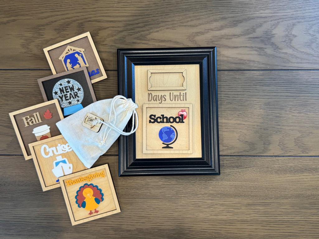 Countdown board with assorted interchangeable event tiles